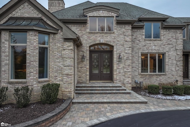 doorway to property featuring french doors