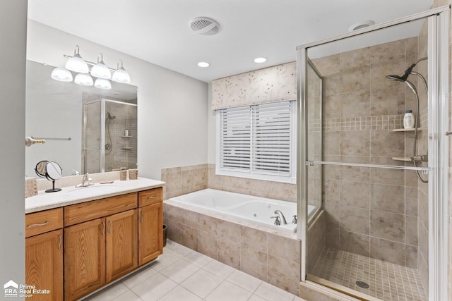 bathroom with tile patterned floors, vanity, and plus walk in shower