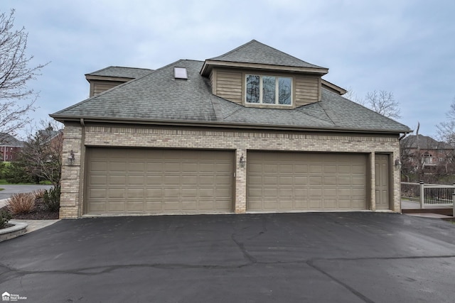 view of side of home with a garage