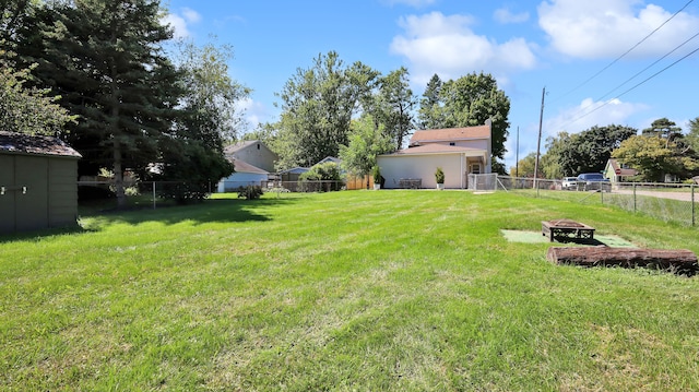 view of yard with a fire pit