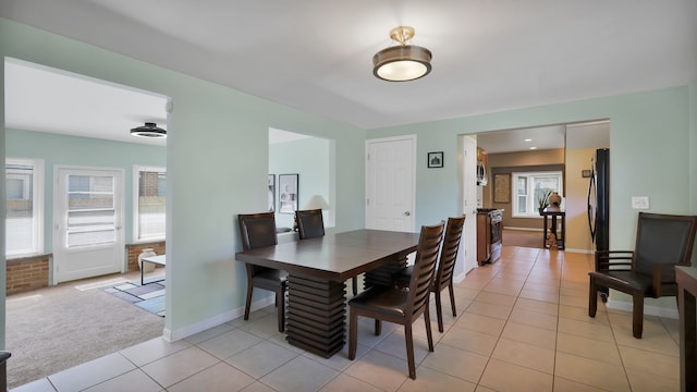 tiled dining space with a wealth of natural light