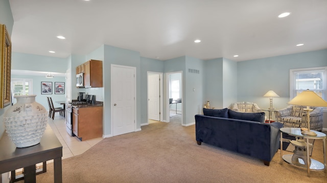 3105 Saint Clair Dr, Rochester Hills, MI 48309 - living room with plenty of natural light, light carpet, recessed lighting, baseboards, and light tile patterned floors