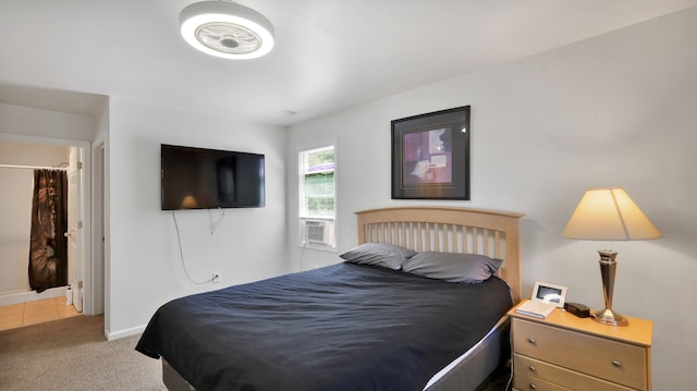 bedroom featuring light carpet