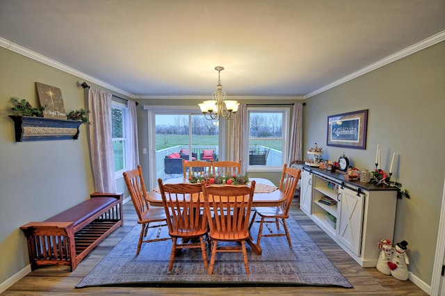 dining space with an inviting chandelier, ornamental molding, and dark hardwood / wood-style flooring