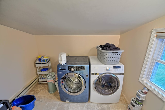 washroom with a baseboard radiator and separate washer and dryer