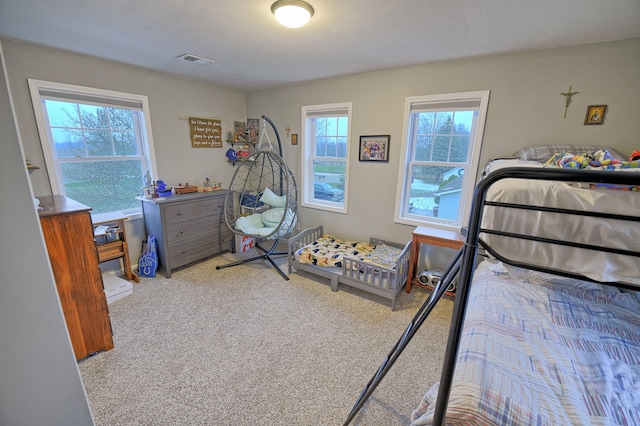 carpeted bedroom featuring a textured ceiling