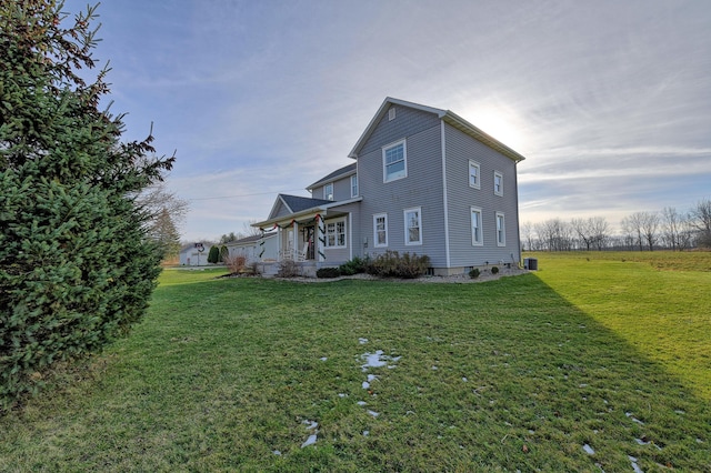 view of property exterior with a yard