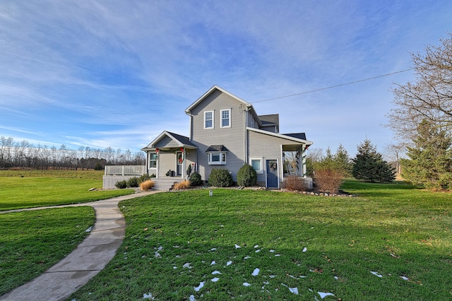 front facade with a front lawn and covered porch