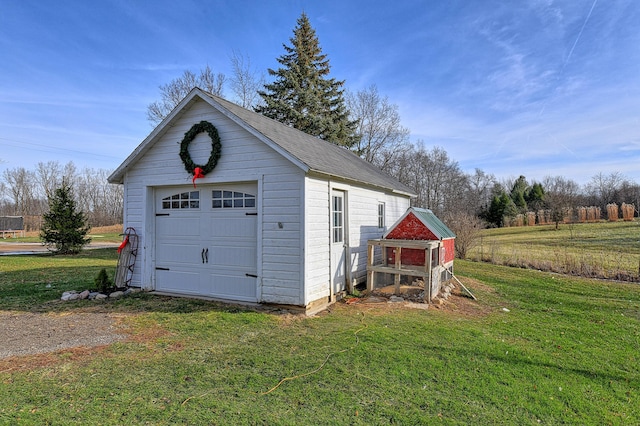 garage featuring a yard