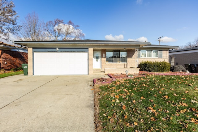 ranch-style house with a front lawn and a garage