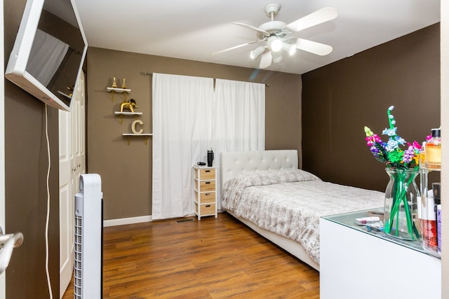 bedroom featuring ceiling fan and wood-type flooring