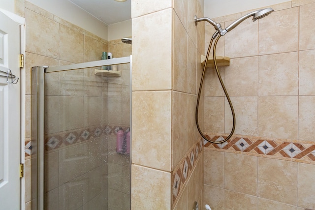 bathroom featuring an enclosed shower