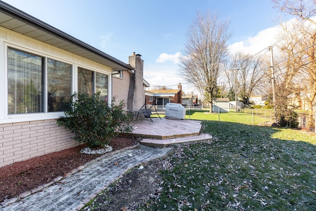 view of yard with a wooden deck