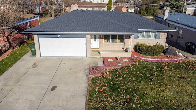 single story home with a garage and a front yard