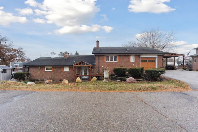 view of front of house featuring a carport and a garage