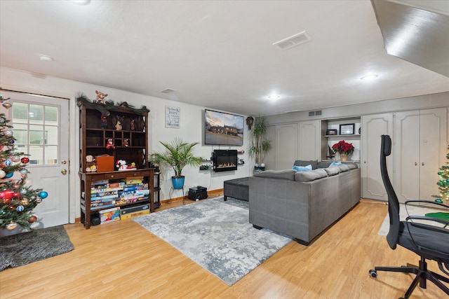 living room with light hardwood / wood-style floors