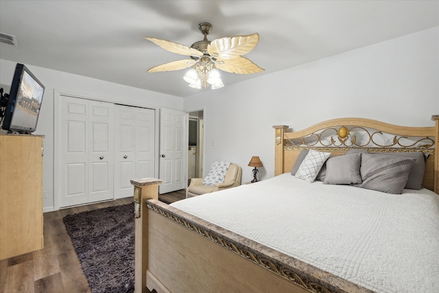 bedroom with dark hardwood / wood-style flooring, ceiling fan, and a closet