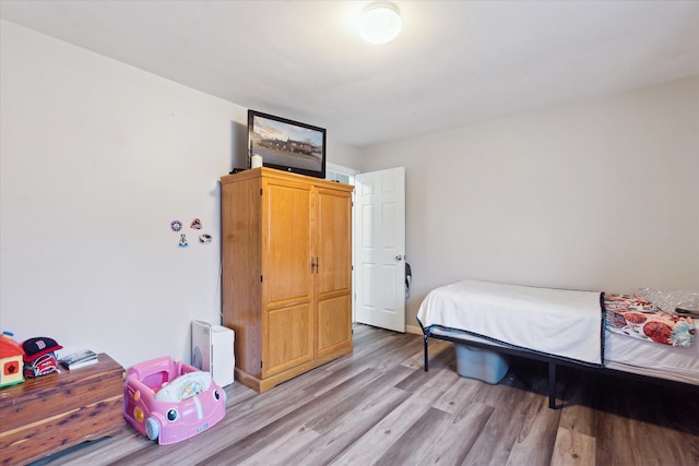 bedroom with light hardwood / wood-style flooring