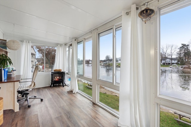 sunroom with a water view