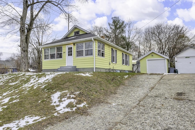 view of front of house featuring an outbuilding and a garage