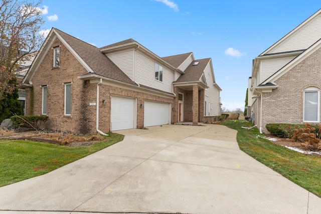 view of front facade with a front lawn and a garage