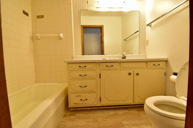 full bathroom with vanity, toilet, and tiled shower / bath combo