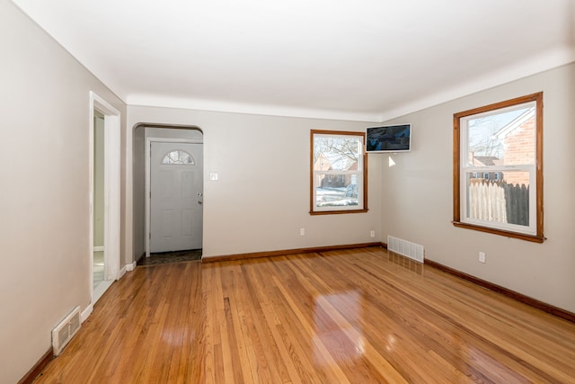 spare room with light wood-type flooring