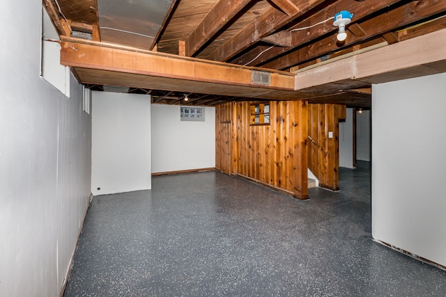 basement with wood walls