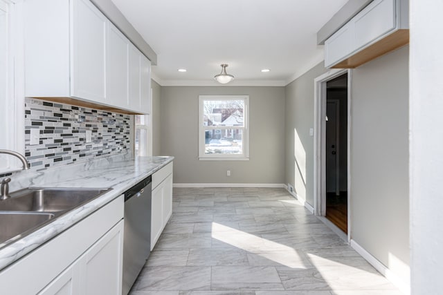 kitchen featuring sink, crown molding, white cabinets, decorative backsplash, and stainless steel dishwasher