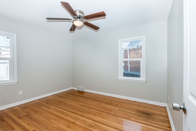 empty room featuring light hardwood / wood-style flooring and ceiling fan