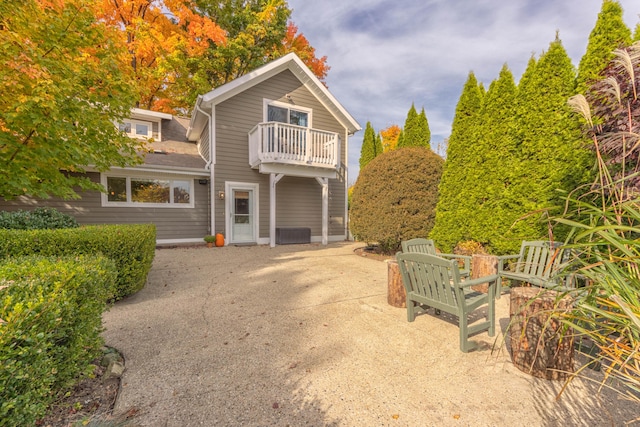 view of front of property with a balcony