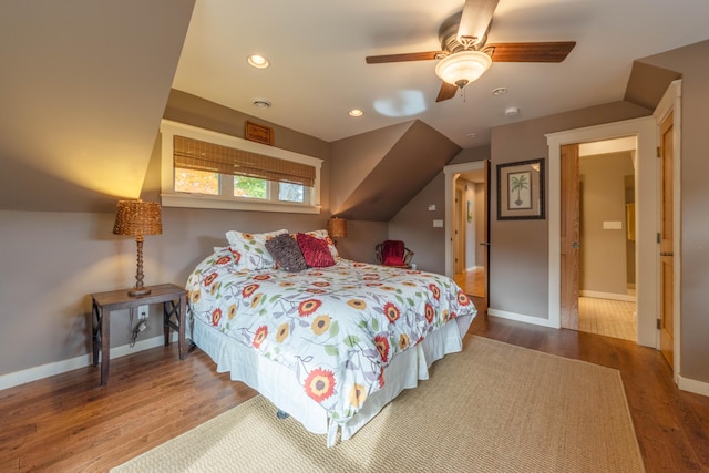 bedroom with wood-type flooring, lofted ceiling, and ceiling fan