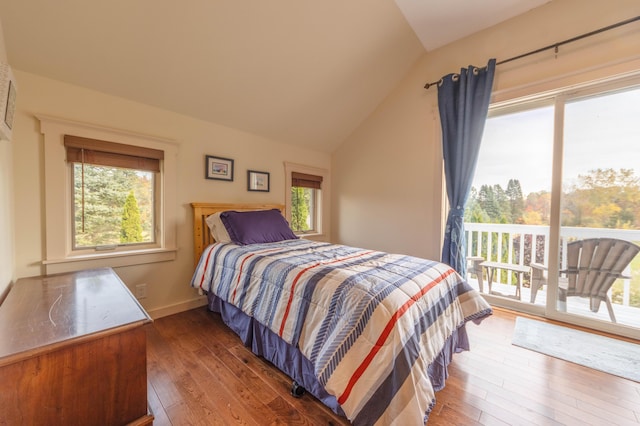 bedroom with dark wood-type flooring, access to outside, and vaulted ceiling