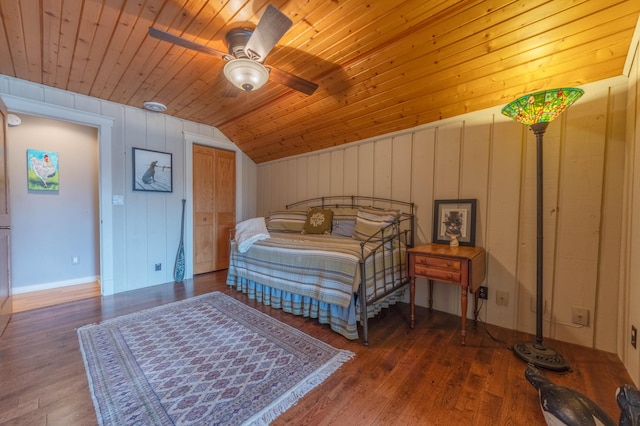 bedroom featuring ceiling fan, lofted ceiling, dark hardwood / wood-style floors, and wooden ceiling