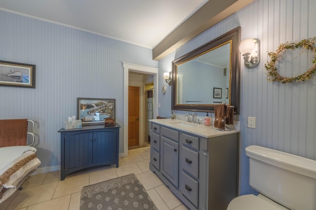 bathroom with crown molding, tile patterned floors, vanity, and toilet