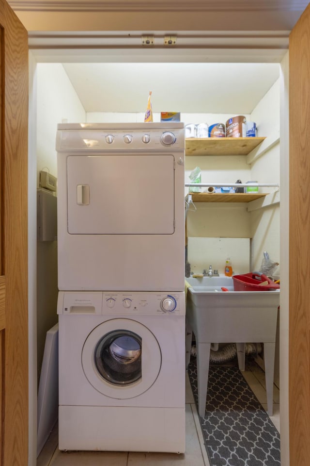 washroom featuring stacked washer and dryer