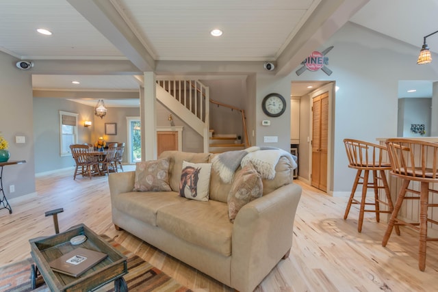 living room featuring wooden ceiling, beamed ceiling, and light wood-type flooring