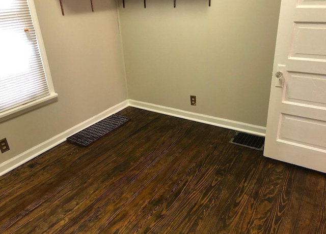 unfurnished room featuring dark hardwood / wood-style floors