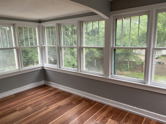 unfurnished sunroom featuring plenty of natural light