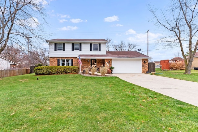 view of property featuring a front yard and a garage