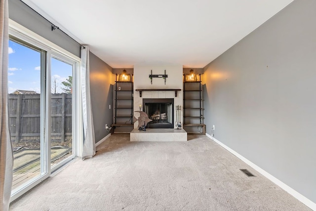 unfurnished living room with light colored carpet