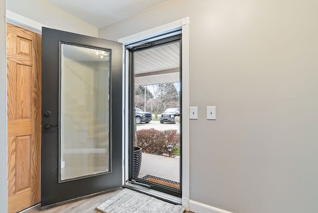 doorway with light hardwood / wood-style floors