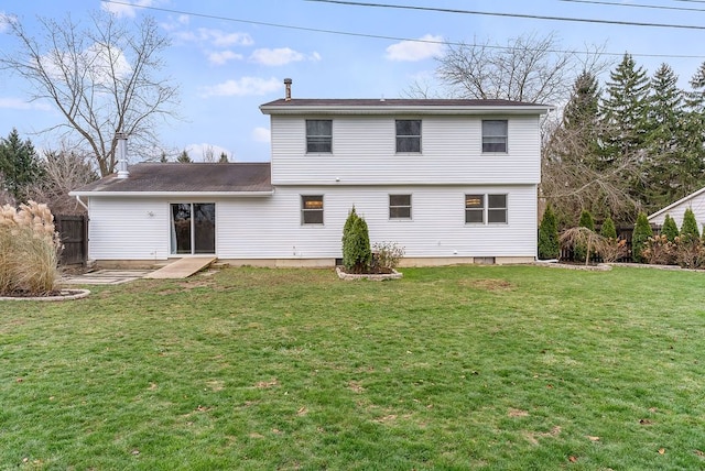 back of house featuring a yard