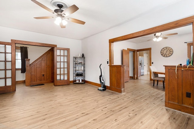 interior space featuring ceiling fan, french doors, and light hardwood / wood-style floors