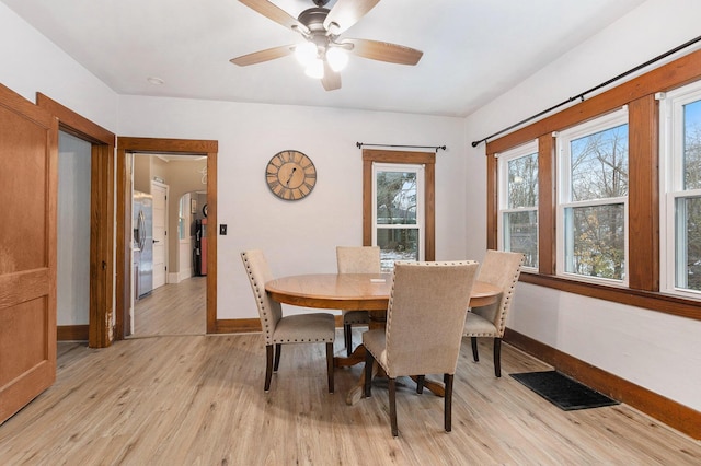 dining area featuring ceiling fan and light hardwood / wood-style flooring