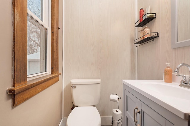 bathroom featuring vanity and toilet