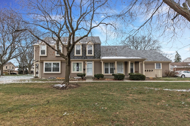 new england style home with a front lawn