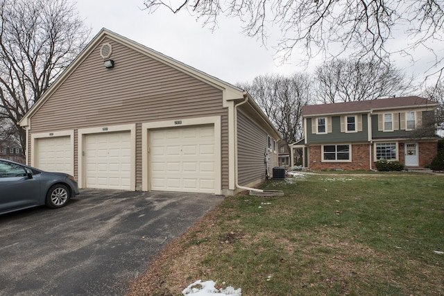 exterior space with a lawn and a garage