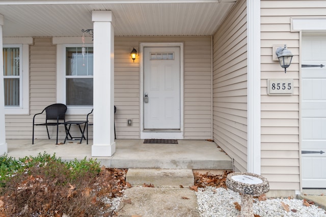 doorway to property with covered porch