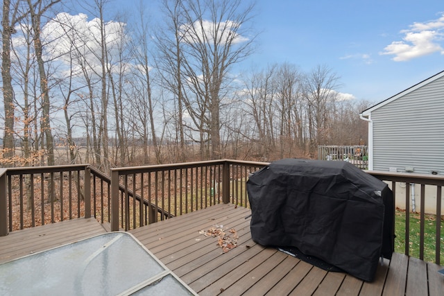 wooden terrace with area for grilling